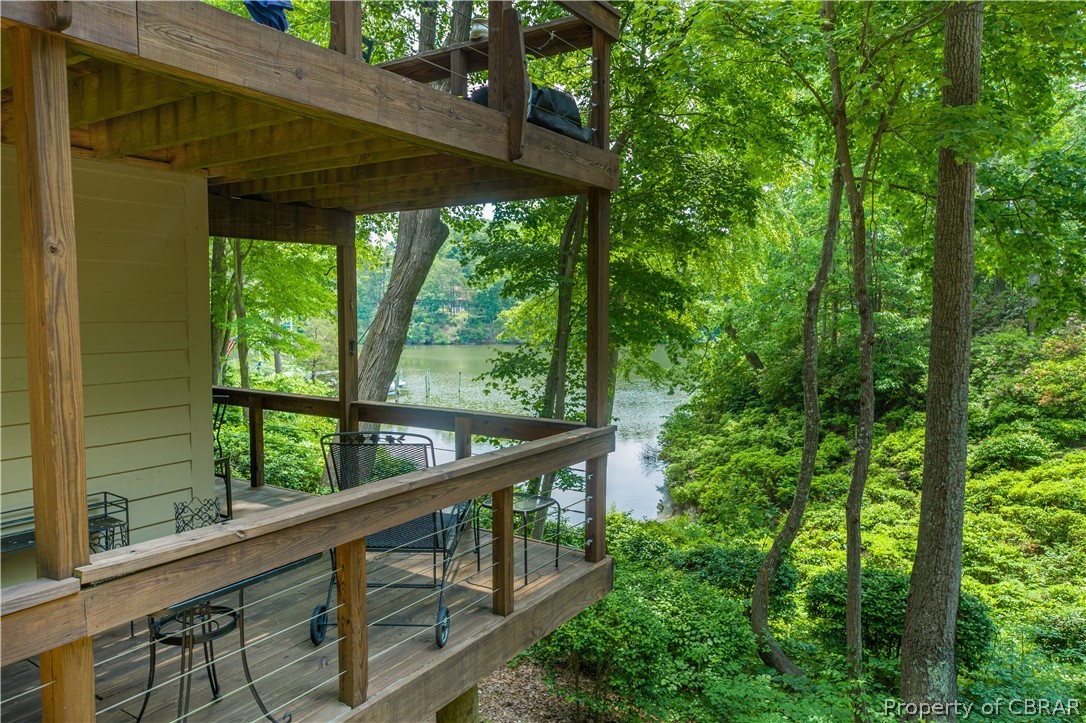 68 Villa Ridge Drive, Unit 4 Hartfield, VA 23071 - Photo 21 of 30 Wrap around deck, great entertaining spaces.