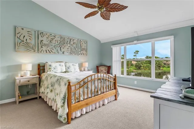 a bed sitting in a room next to a window