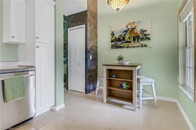 a room with painting and a table