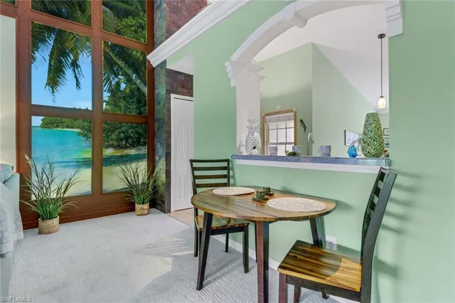 a view of a dining room with furniture window and outside view