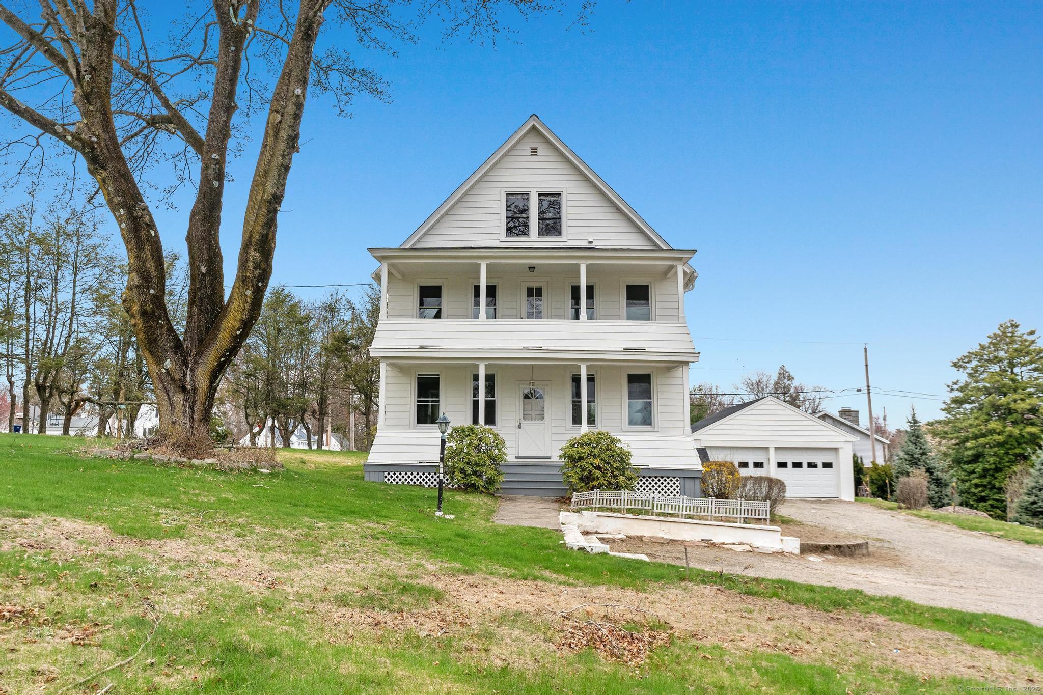 189 Derby Avenue Orange, CT 06477 - Photo 1 of 1 a front view of a house with a yard