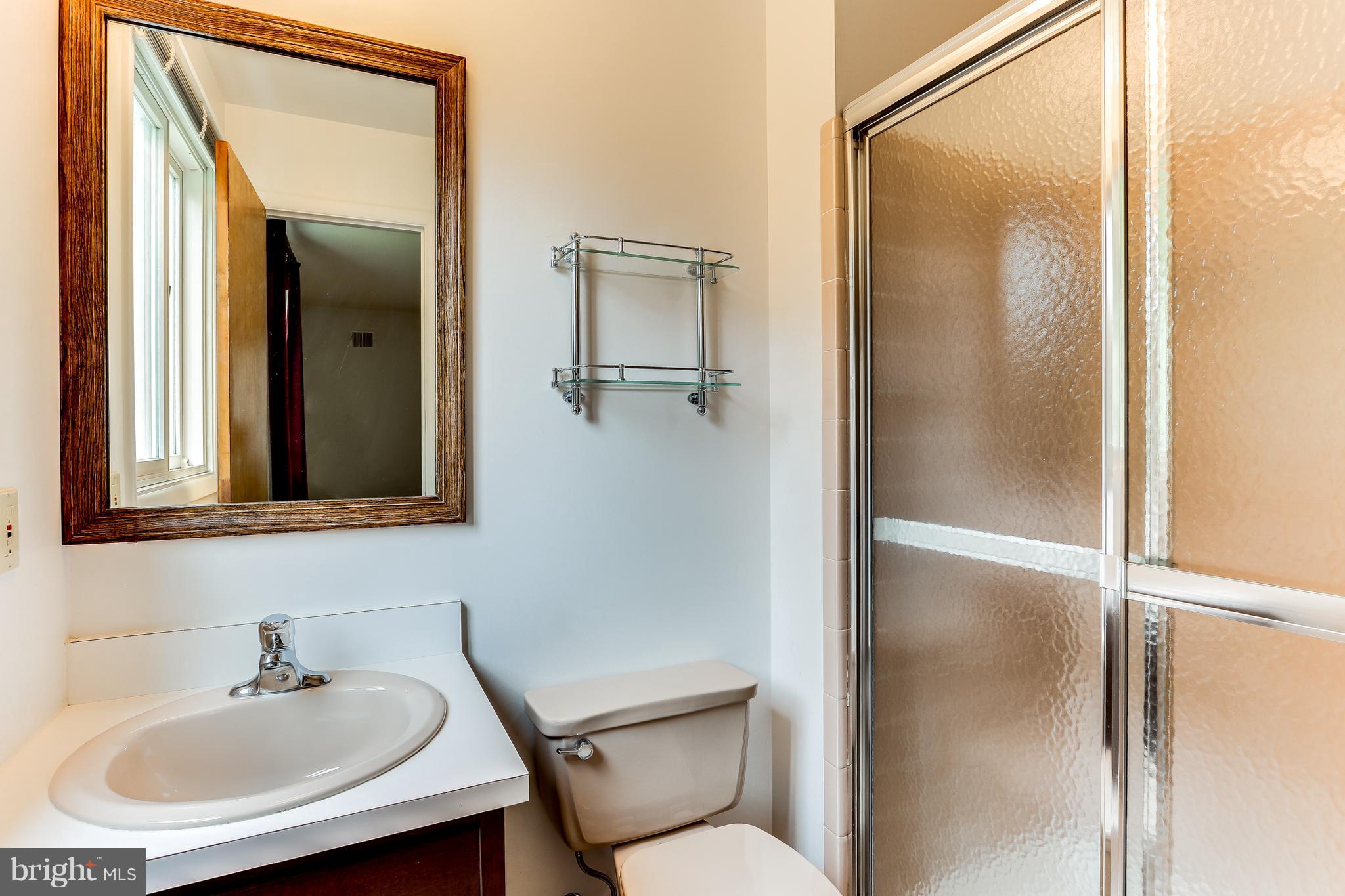 1713 Gamewell Road Silver Spring, MD 20905 - Photo 18 of 30 a bathroom with a sink and mirror