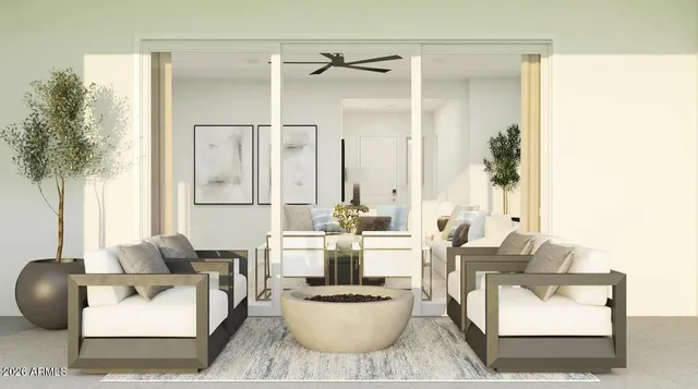 a living room with furniture and a potted plant