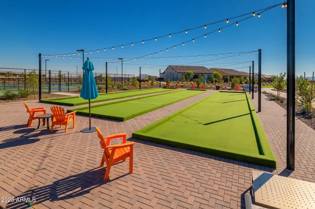 a outdoor living space with patio furniture and a fireplace