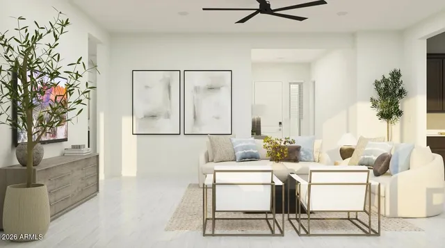 a living room with furniture and a potted plant