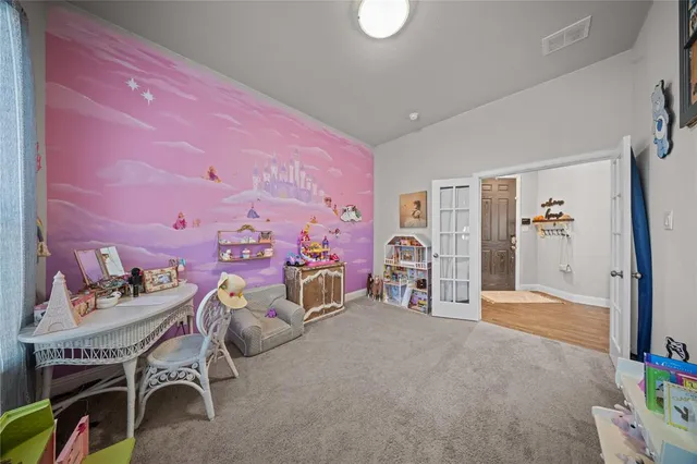a bedroom with furniture and a chandelier