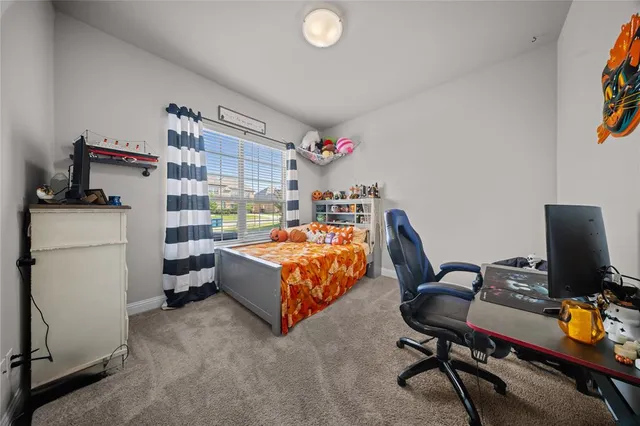 a bedroom with a workspace