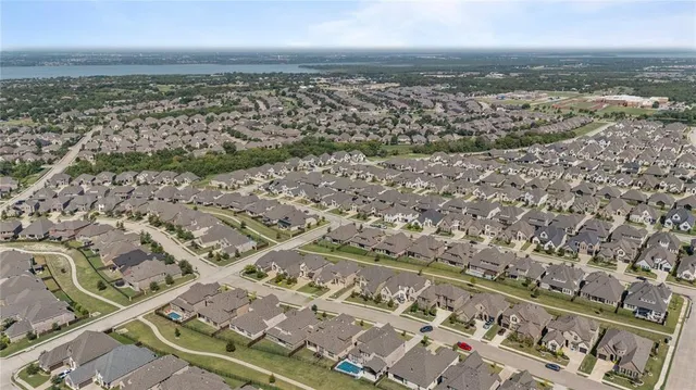 an aerial view of residential building and ocean