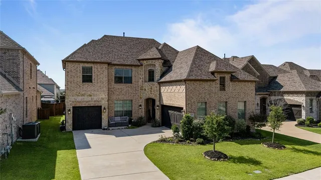 a aerial view of a house with a yard and plants