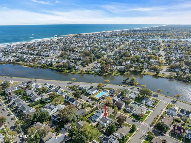 an aerial view of a house with a lake view