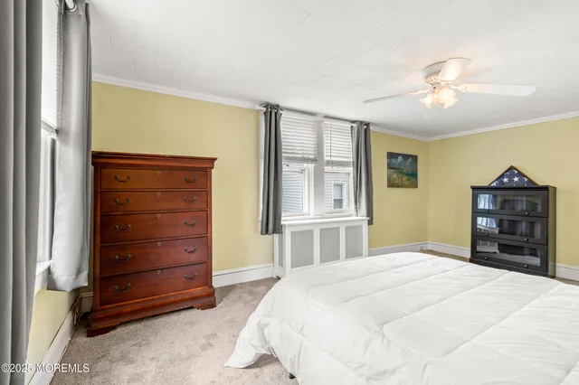 a bedroom with a bed a desk and chair