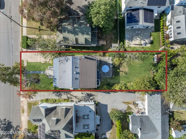 a view of a building with a yard