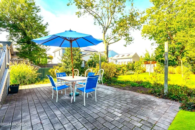 a front view of a house with garden and porch