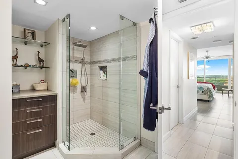 a bathroom with a shower and a sink