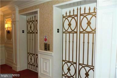 12246 Roundwood Road, Unit 405 Lutherville-Timonium, MD 21093 - Photo 2 of 16 a view of an entryway with wooden floor