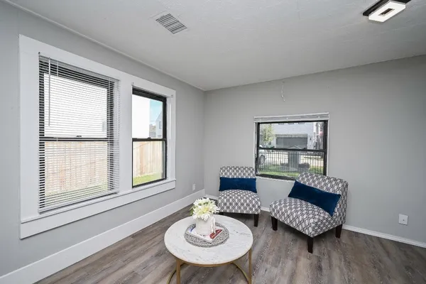 a living room with furniture and a window
