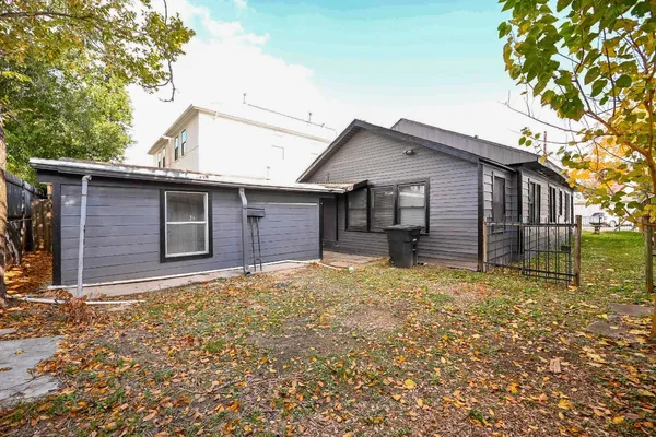 a house with trees in the background