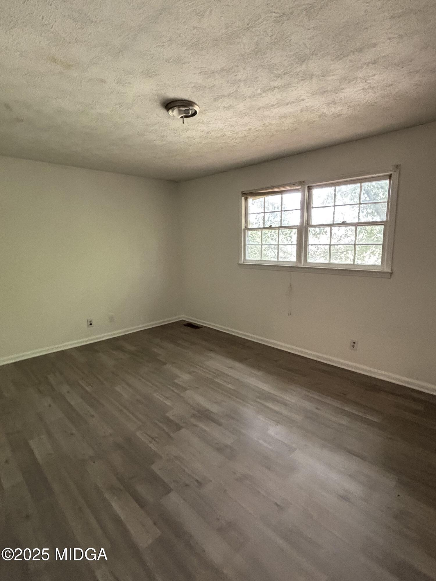 1890-1892 Clinton Road Macon, GA 31211 - Photo 11 of 19 an empty room with a window