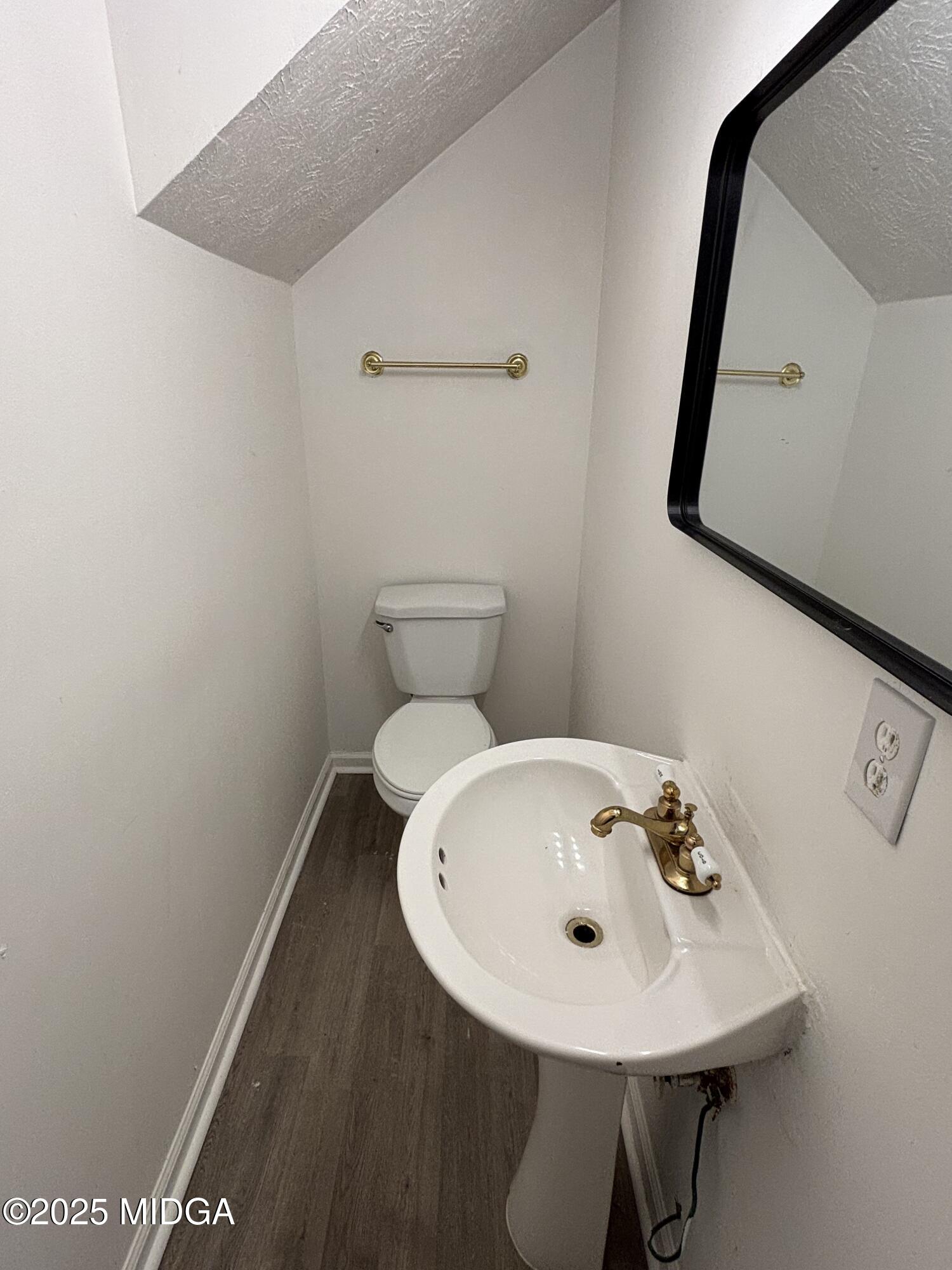1890-1892 Clinton Road Macon, GA 31211 - Photo 6 of 19 a bathroom with a sink and a mirror