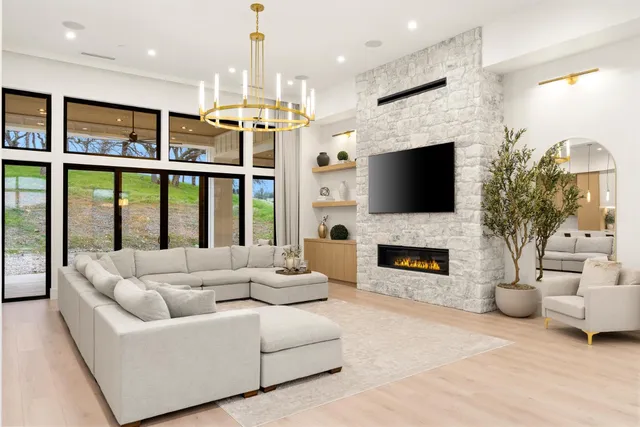 a large kitchen with a table and chairs