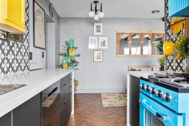 a dining room with furniture and a potted plant