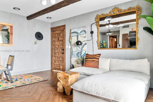 a living room with furniture and a window