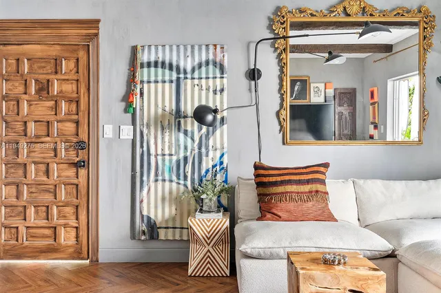 a view of a pathway of a house with potted plants