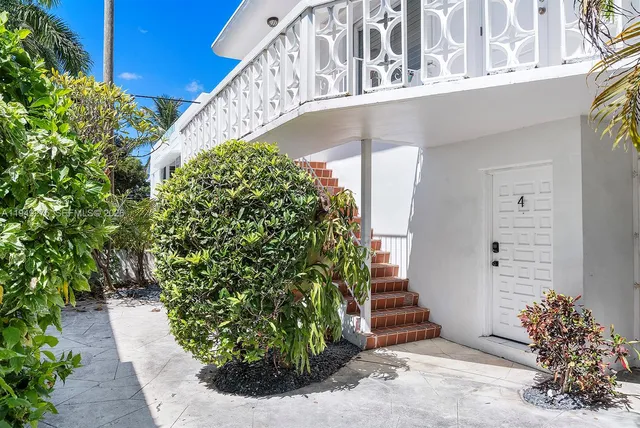 a living room with furniture and windows