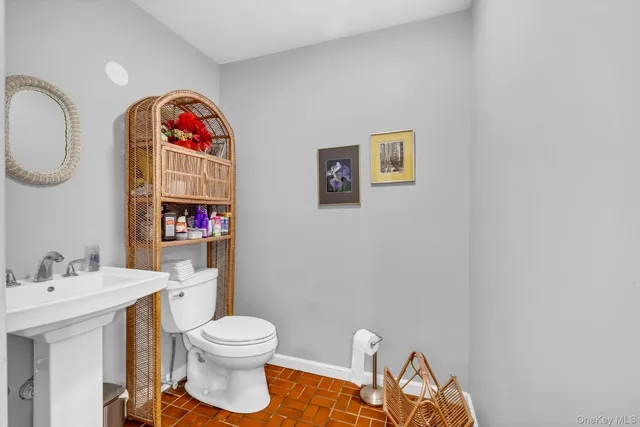 a dining room with furniture a chandelier and wooden floor