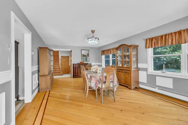 a bathroom with a toilet a sink and a mirror