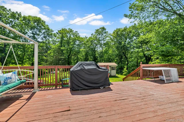 a bathroom with a toilet a sink and glass door