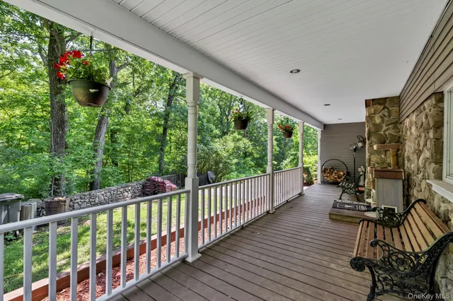 a view of balcony with furniture