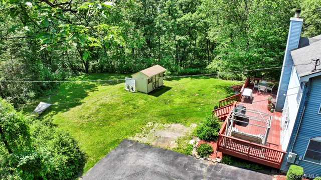 a view of a wooden deck with a yard