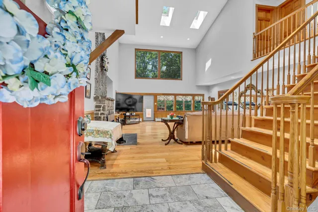 a view of staircase with furniture and a potted plant