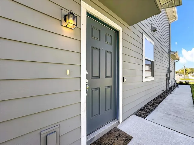 a kitchen with kitchen island a sink and a large window