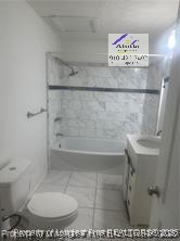 1235 Wilderness Drive Spring Lake, NC 28390 - Photo 10 of 11 a bathroom with a toilet and a shower