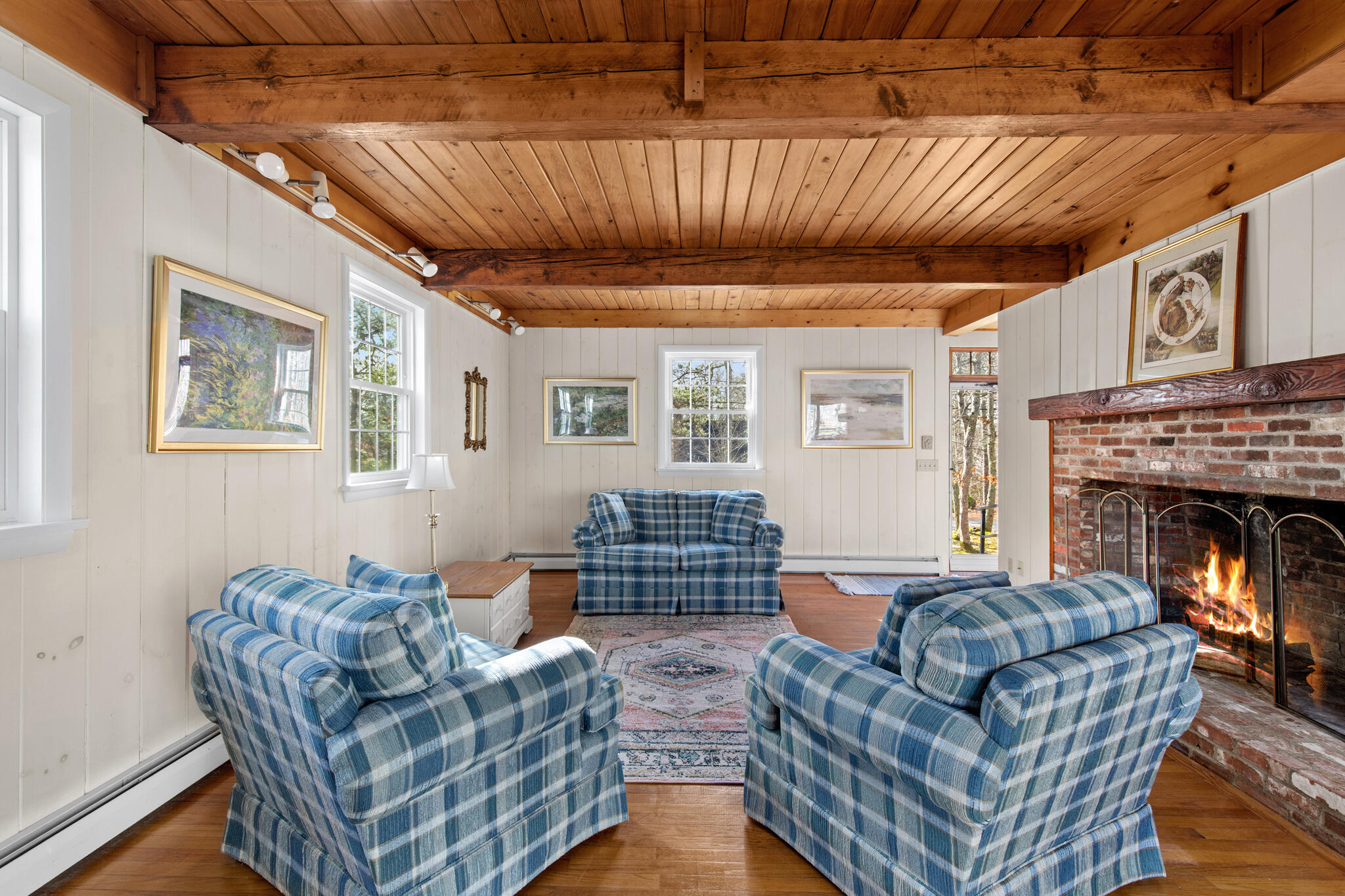 157 Jonathans Way Brewster, MA 02631 - Photo 12 of 38 a living room with furniture a fireplace and a table