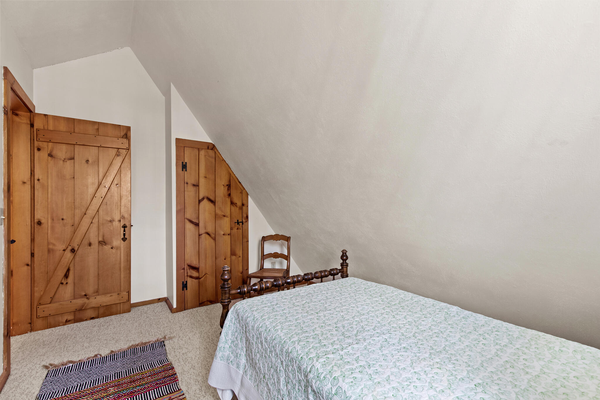 157 Jonathans Way Brewster, MA 02631 - Photo 29 of 38 a bedroom with a bed and a door