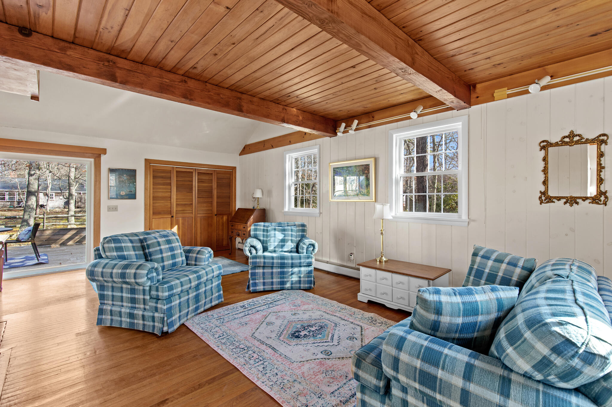 157 Jonathans Way Brewster, MA 02631 - Photo 10 of 38 a living room with furniture ceiling fan and a rug