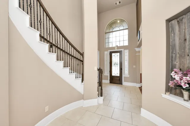 a view of entryway and hall with a window