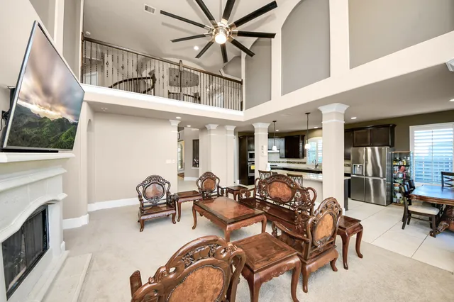 a view of a livingroom with furniture and a flat screen tv