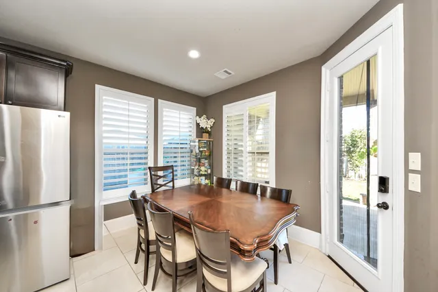 a dining room with furniture and window