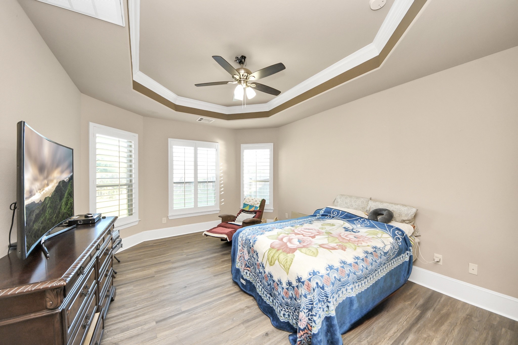 8447 Roland Canyon Drive Cypress, TX 77433 - Photo 23 of 41 a bedroom with a bed and a flat screen tv