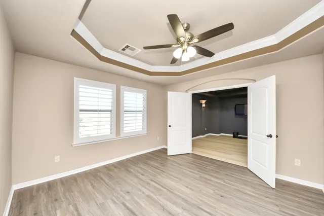 a view of an empty room and wooden floor