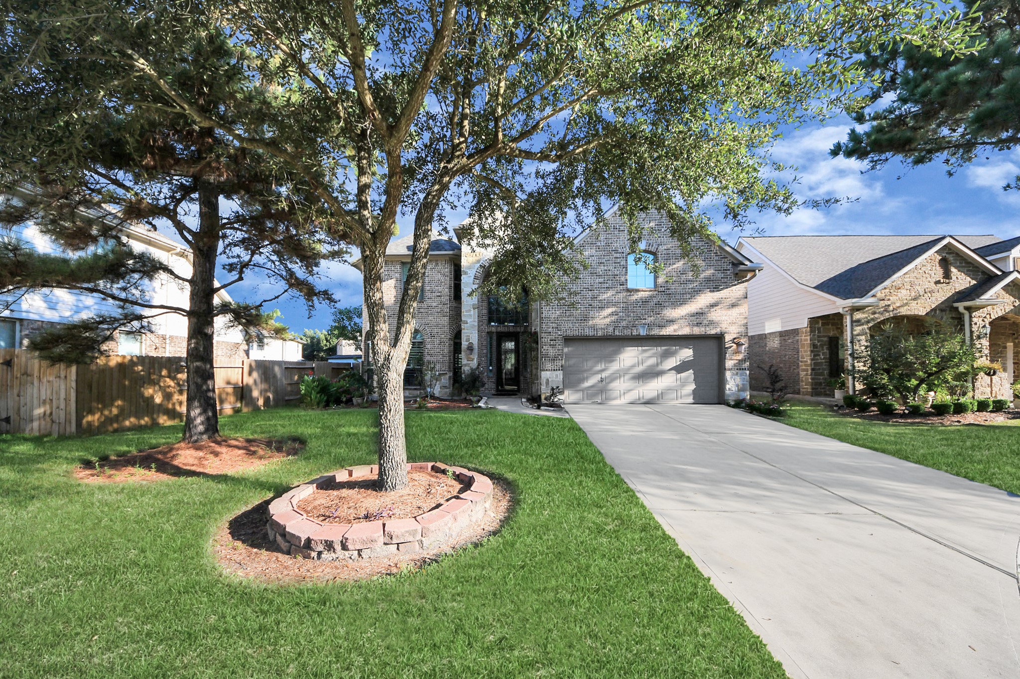 8447 Roland Canyon Drive Cypress, TX 77433 - Photo 6 of 41 a front view of a house with a yard and large trees