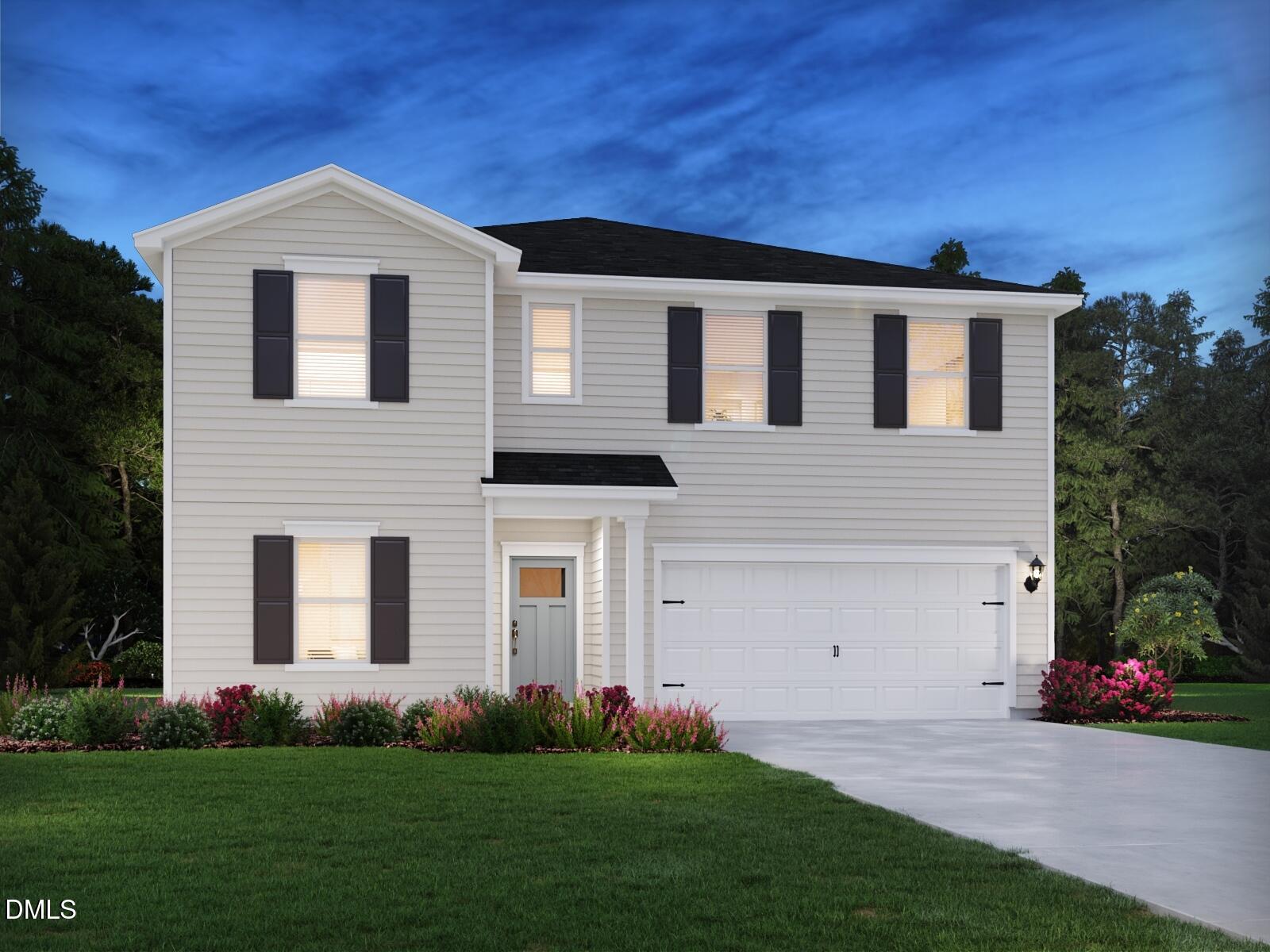 3528 Blythedale Lane Raleigh, NC 27616 - Photo 2 of 37 a front view of a house with a garden and yard