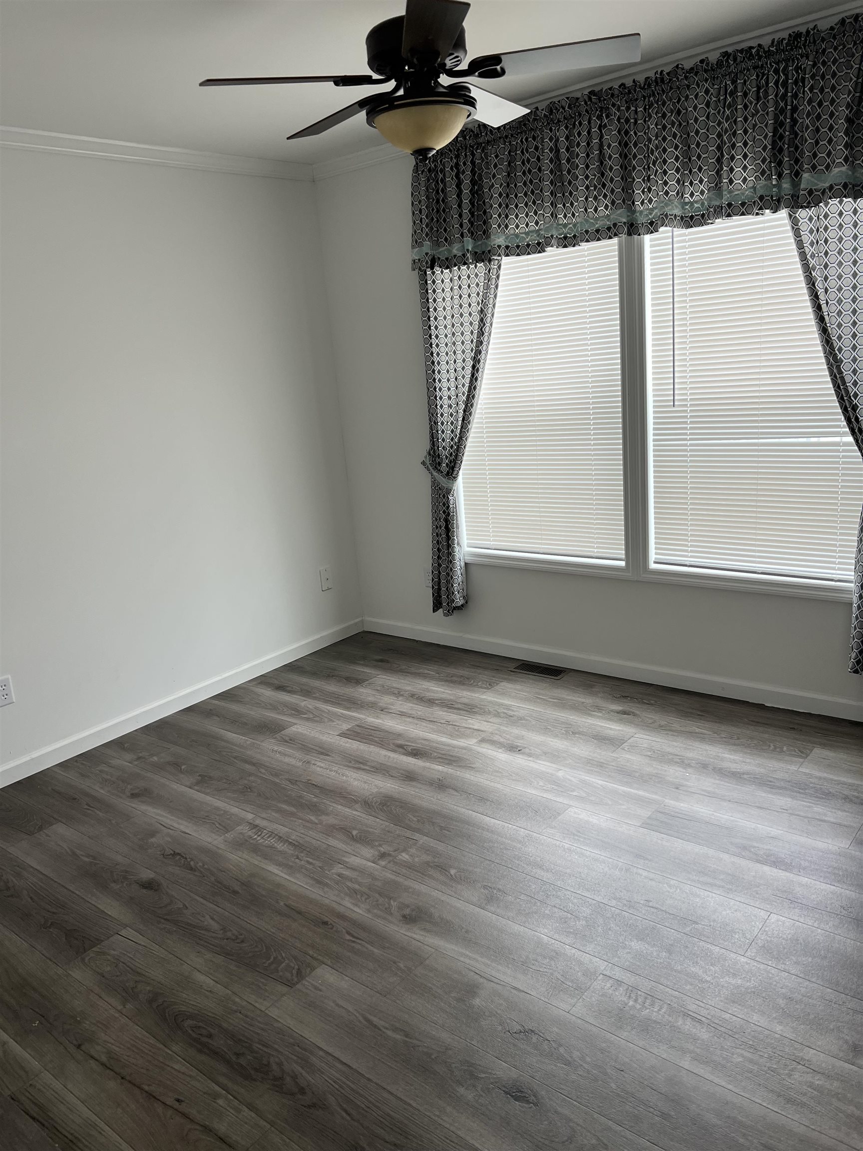 233 Maurice Rio Grande, NJ 08242 - Photo 4 of 6 a view of empty room with wooden floor and fan