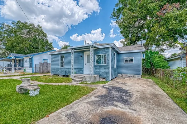 front view of a house with a yard