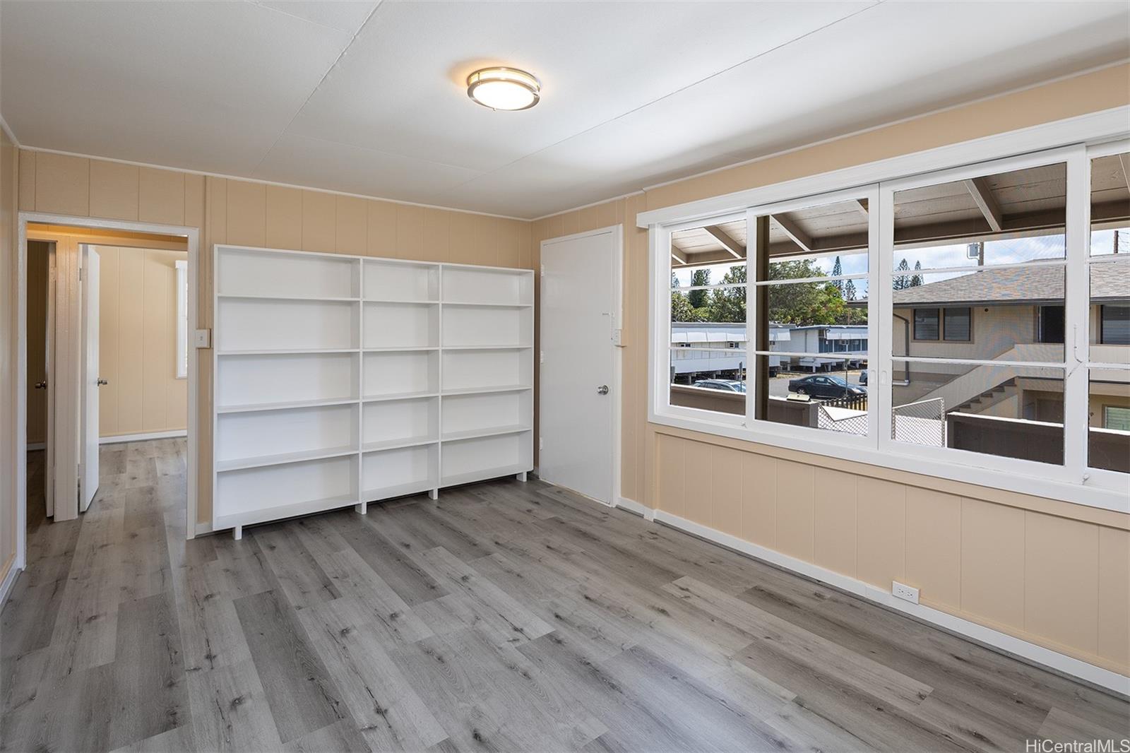 2810 Varsity Circle, Unit 4 Honolulu, HI 96826 - Photo 1 of 1 an empty room with wooden floor and windows