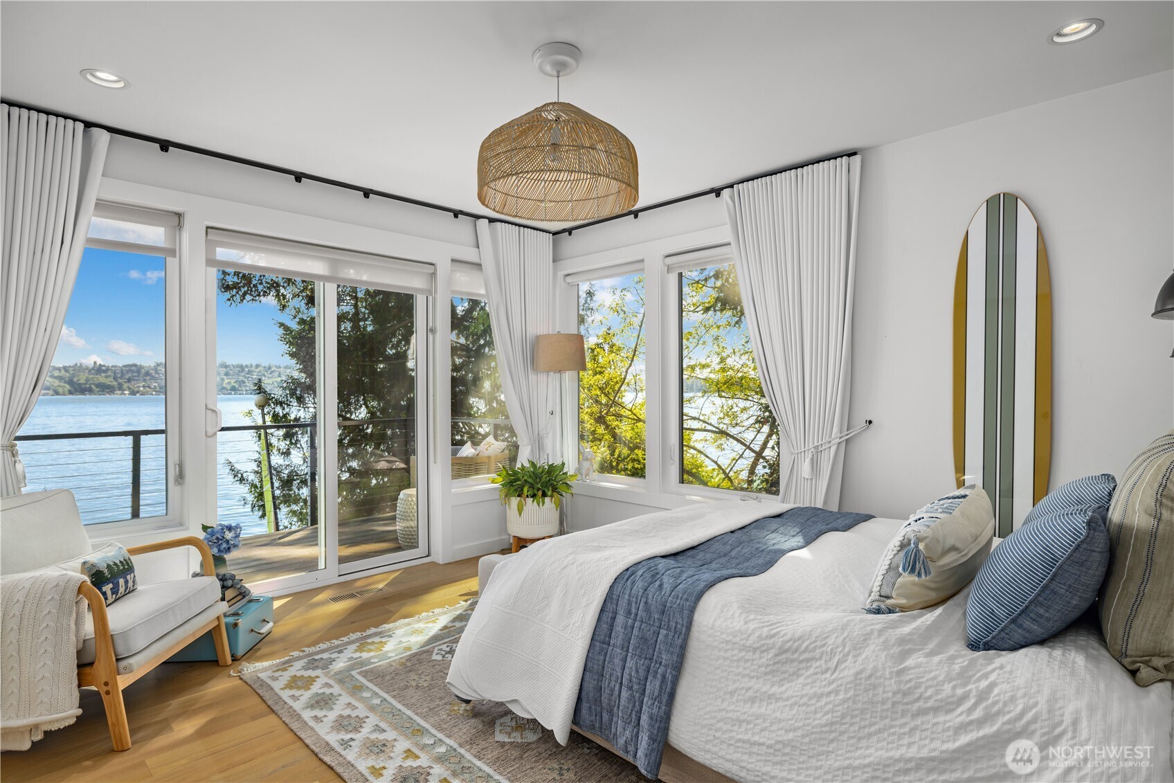 8097 West Mercer Way Mercer Island, WA 98040 - Photo 23 of 40 a bedroom with a bed and a large window